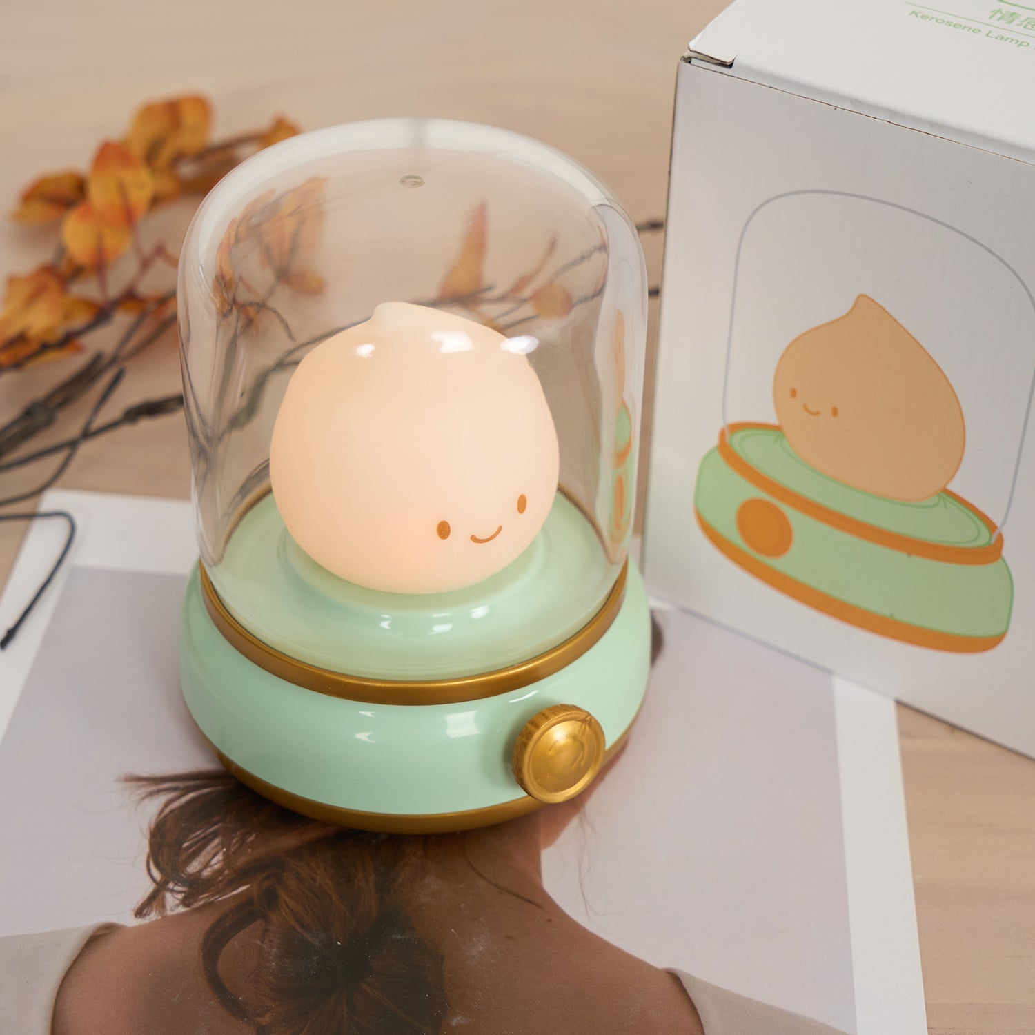 Cute night light with a smiling face on a wooden surface