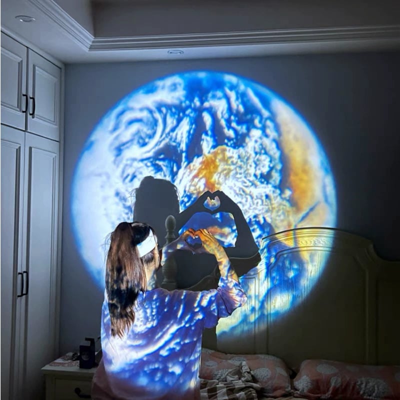 Person using a virtual reality headset with Earth projection on a wall
