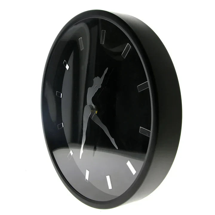 Black wall clock with a minimalist design on a white background