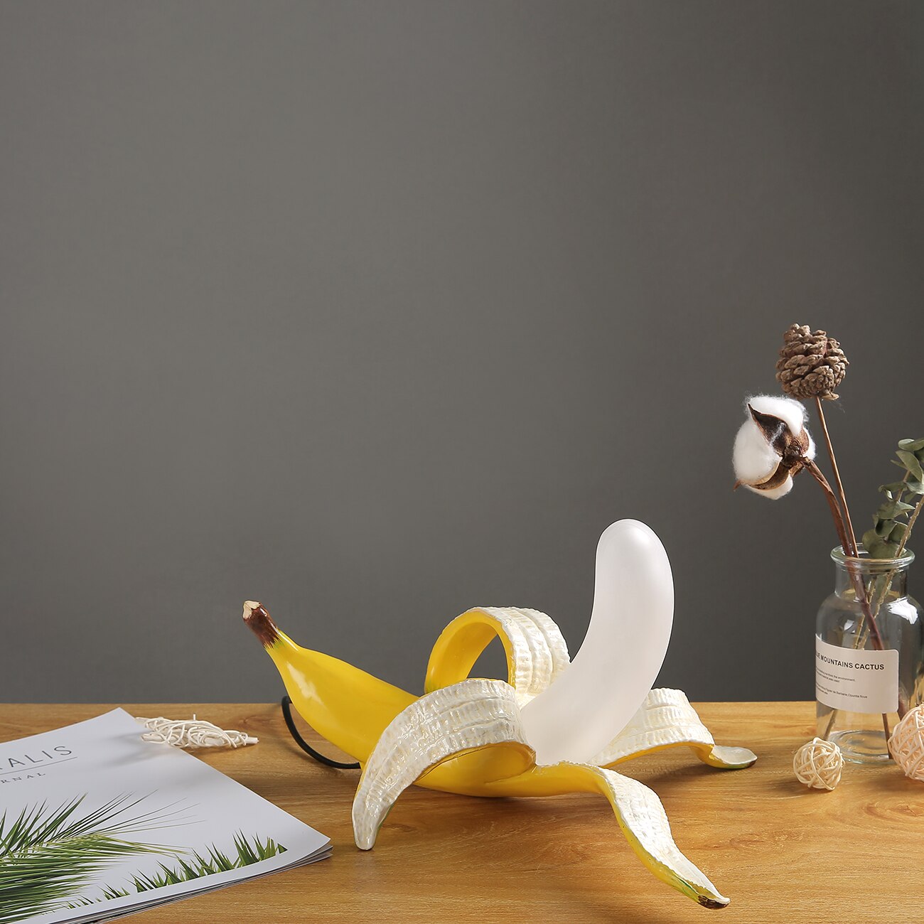 Banana peel on a wooden surface with a dark gray background