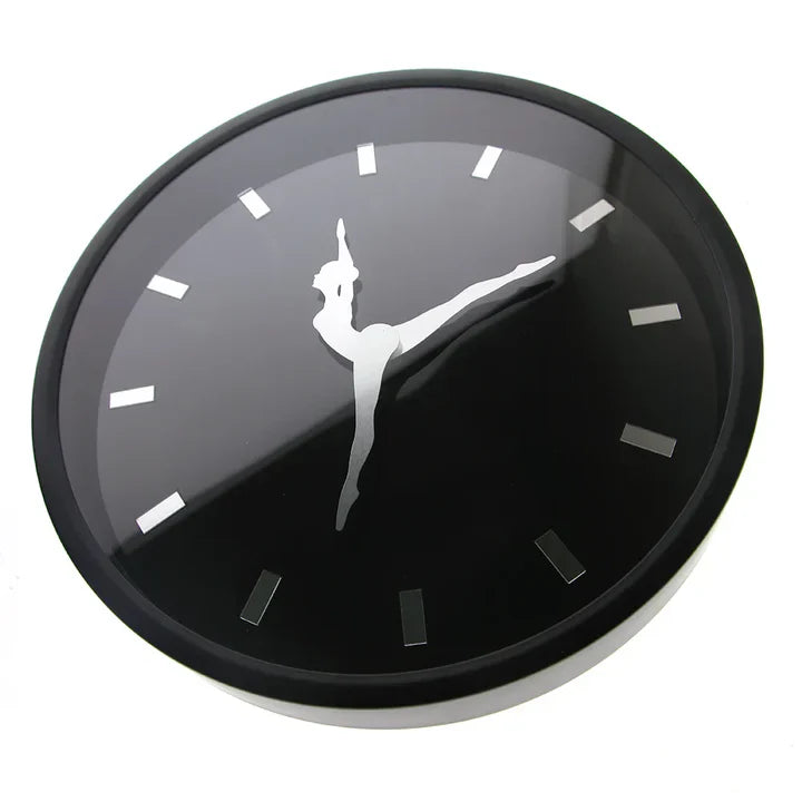Black clock with a white silhouette of a dancer on a white background