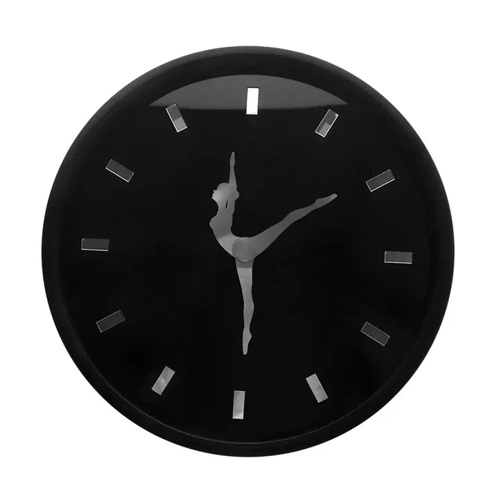 Black clock with a silhouette of a dancer on a white background