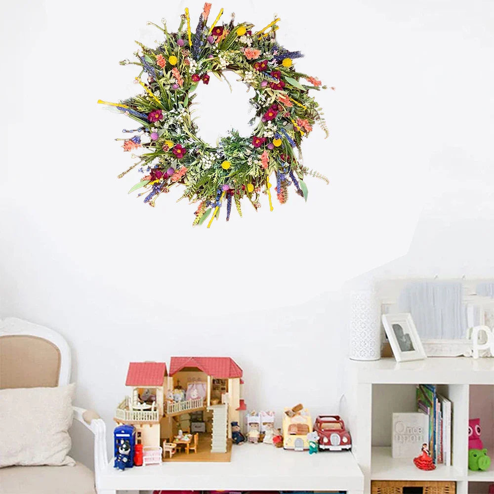 Decorative wreath on a white wall with children's toys and furniture below
