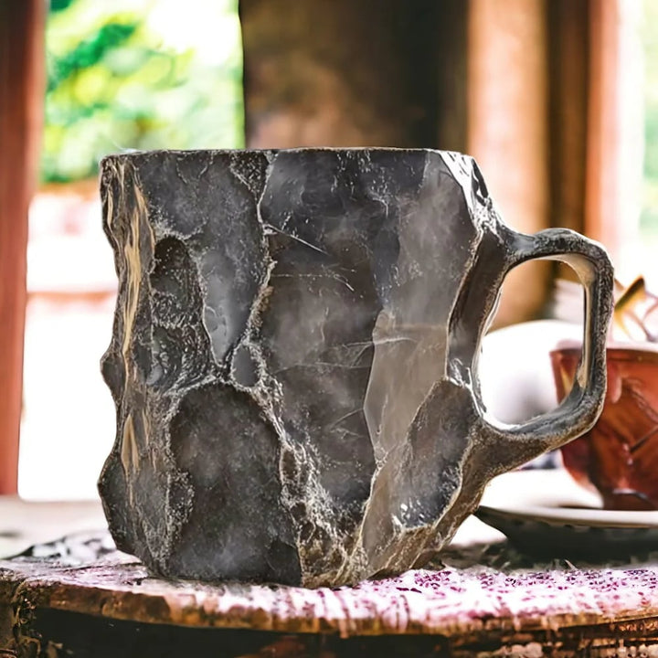 Marble-textured mug on a table with a blurred background