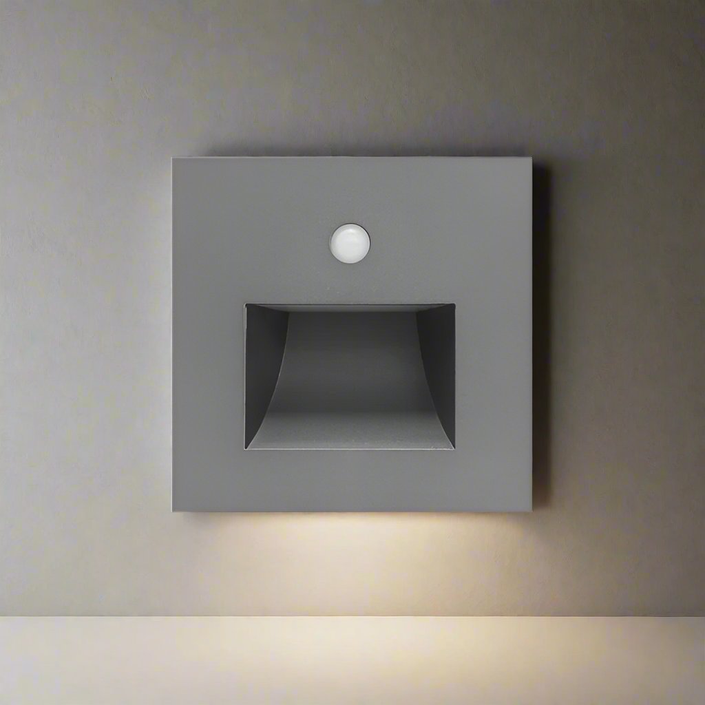 Square wall-mounted light fixture on a neutral wall