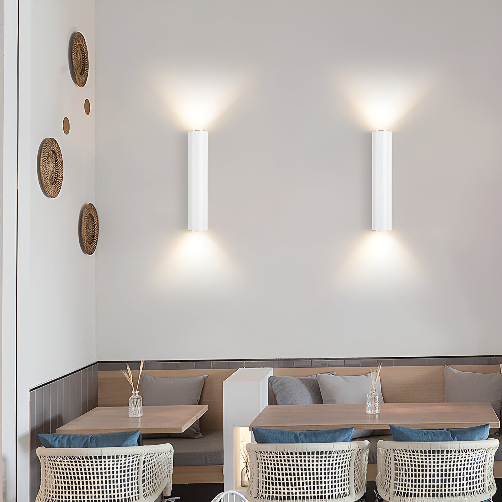 Modern restaurant interior with tables, chairs, and wall decor.