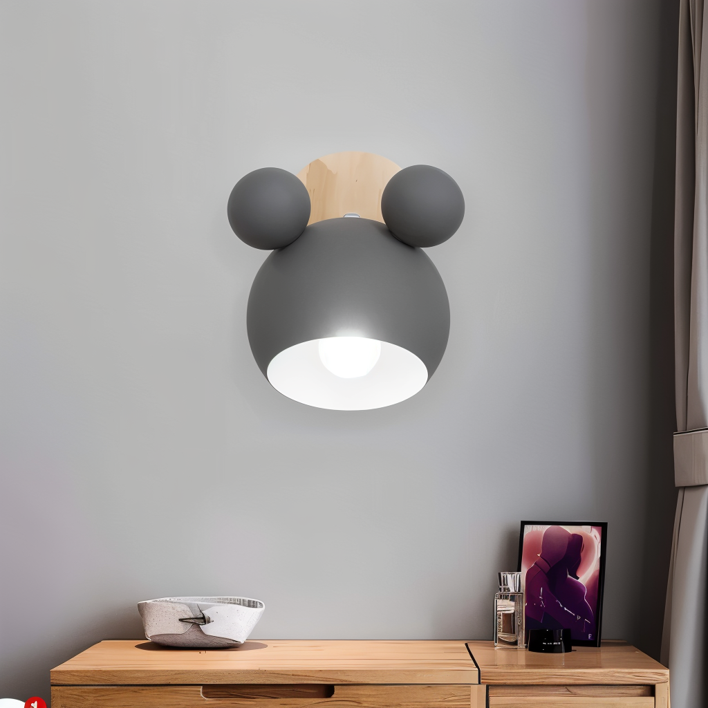 Modern wall lamp with round design on a gray wall above a wooden desk.