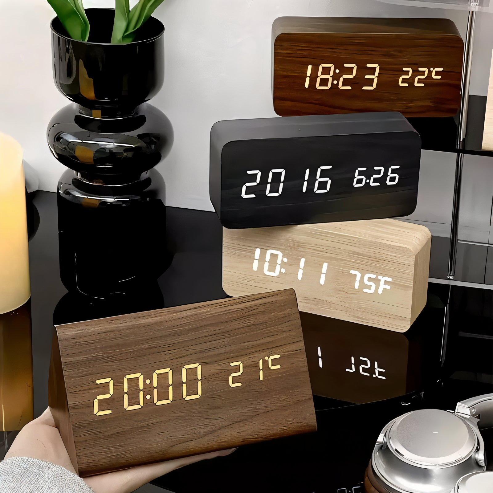 Wooden digital clock displaying time and temperature on a reflective surface.