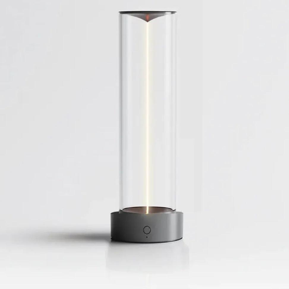 Modern cylindrical lamp with glass cover on a white background