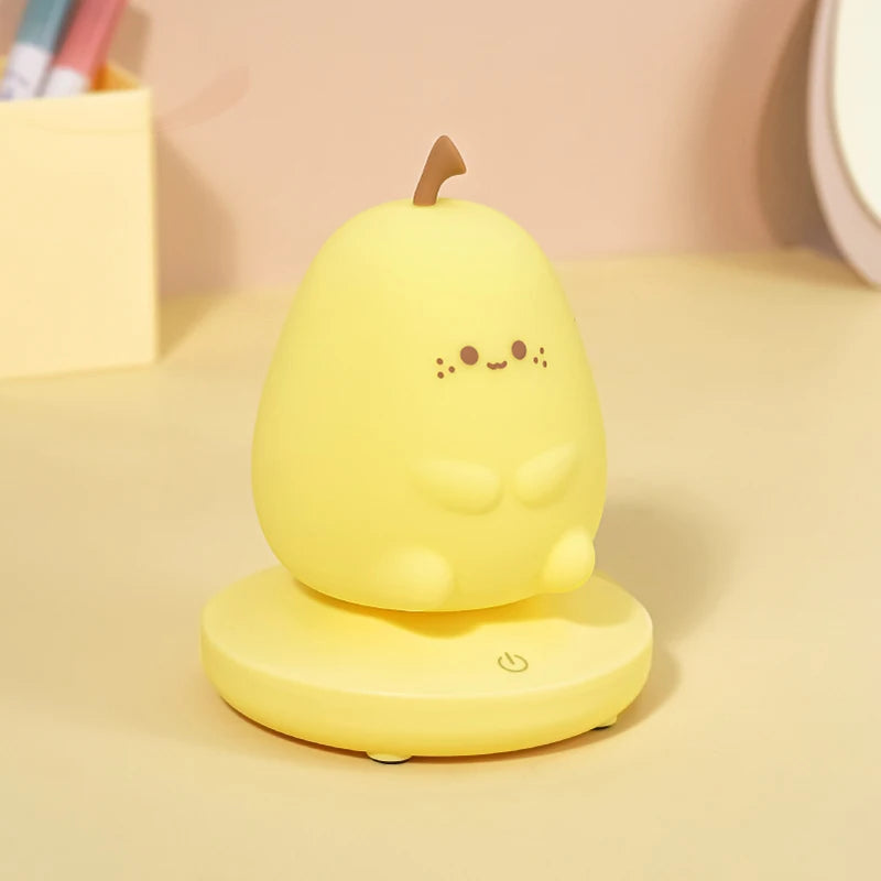 Yellow pear-shaped night light with a smiling face on a beige background