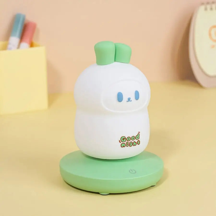 Cute green and white night light with 'Good Night' text on a yellow background