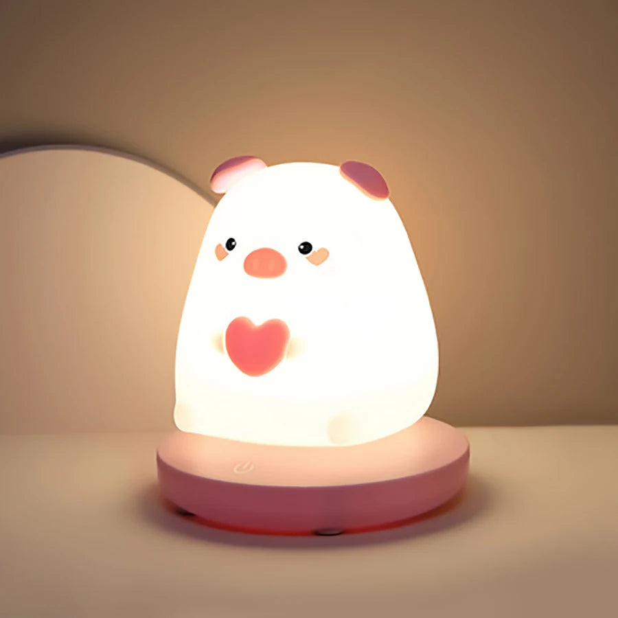 Cute animal-shaped night light with a heart on a beige background