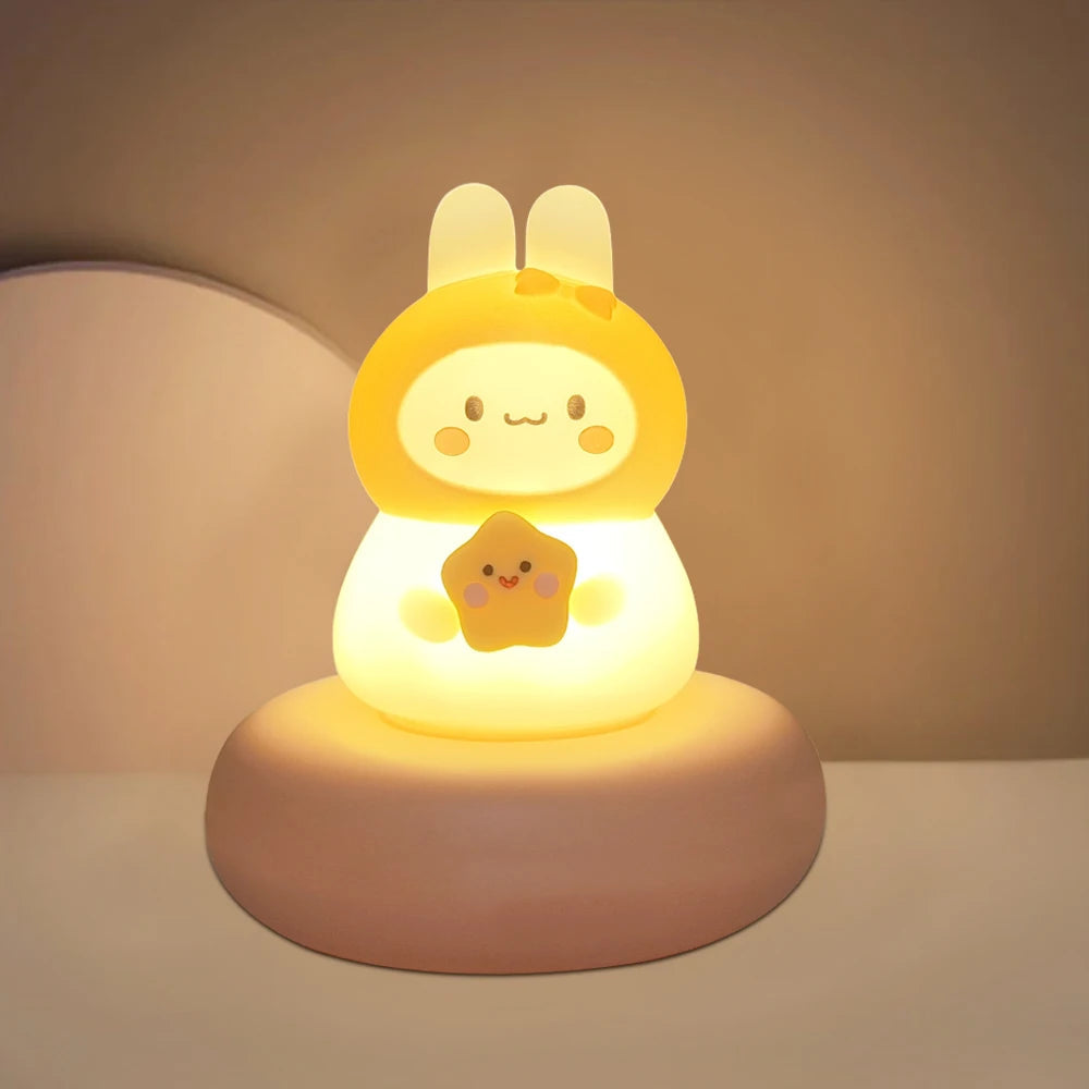 Cute rabbit-shaped night light with a soft glow on a neutral background