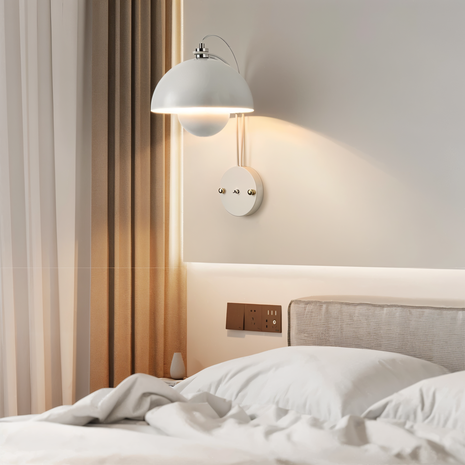 Modern bedroom with a wall-mounted lamp and bed.