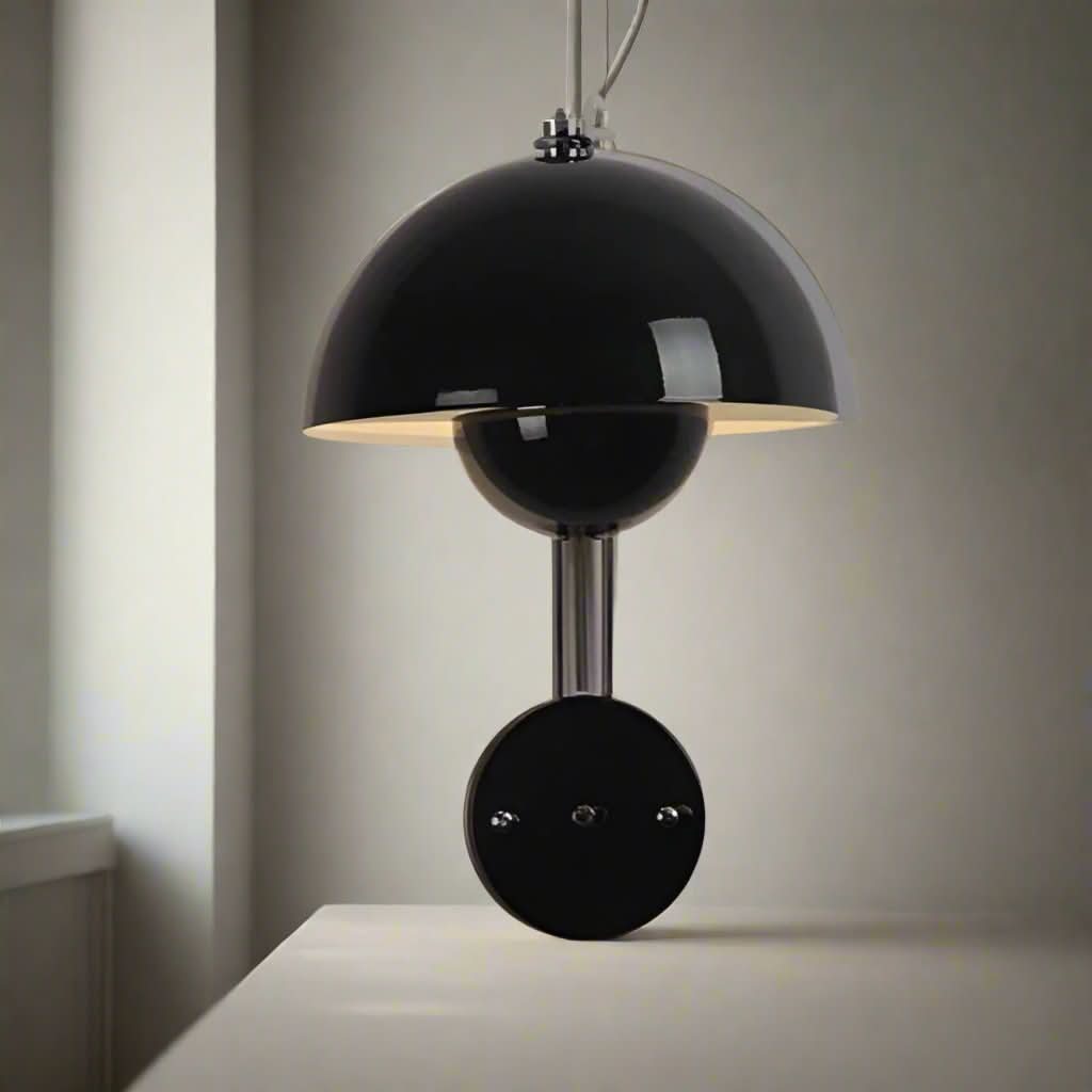 Modern black wall light fixture on a neutral background