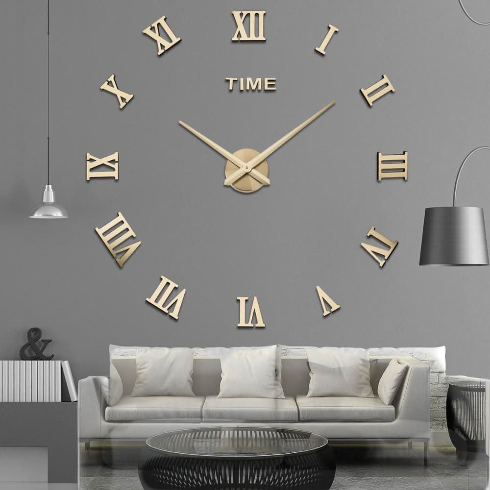 Large wall clock with gold Roman numeral digits on a gray wall above a sofa.