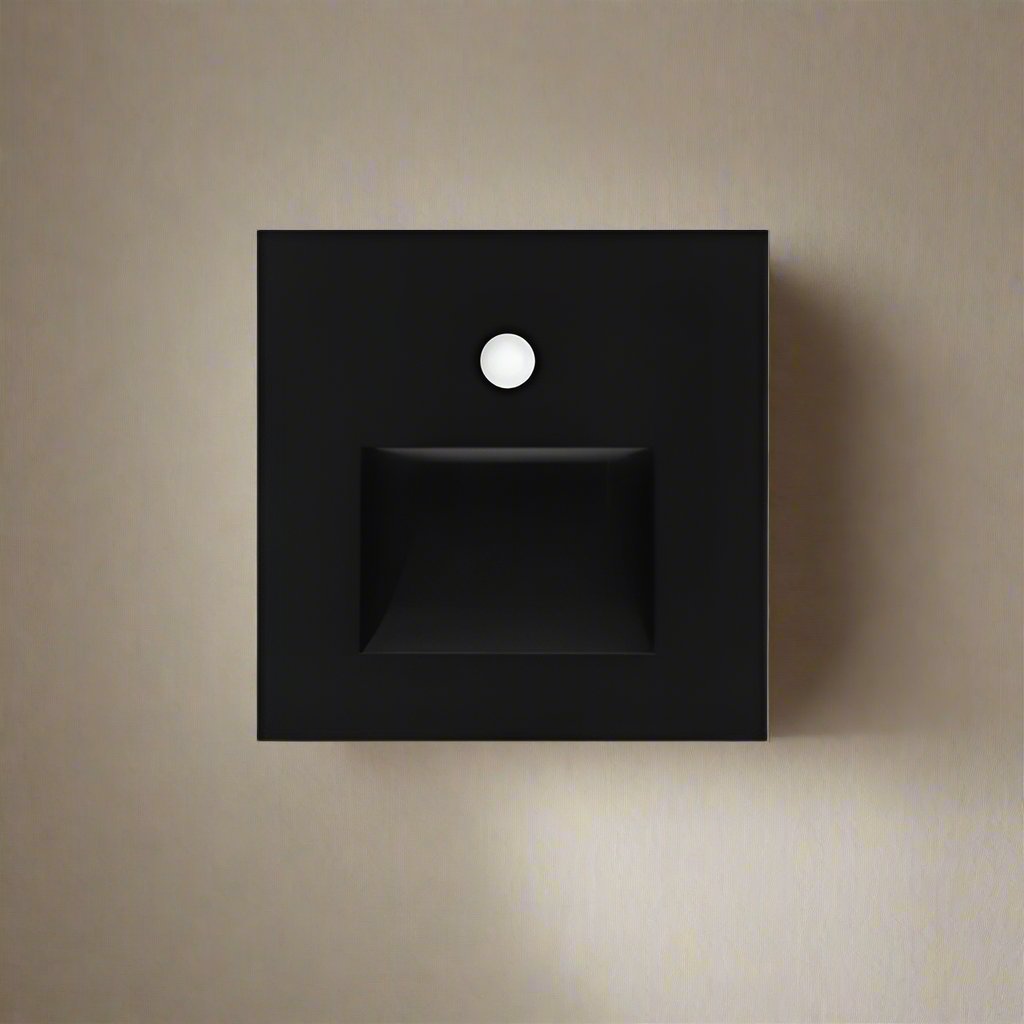 Black square wall light fixture on a beige wall