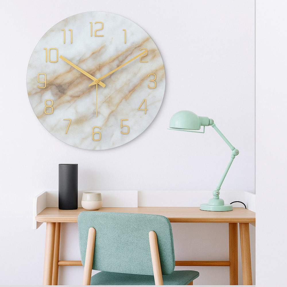 Marble-patterned wall clock on a white wall above a wooden desk with a green chair and lamp.