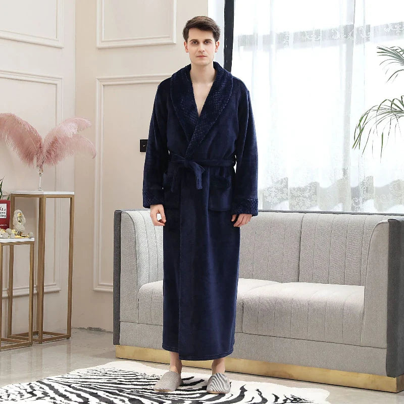 Person wearing a navy blue robe in a modern living room.