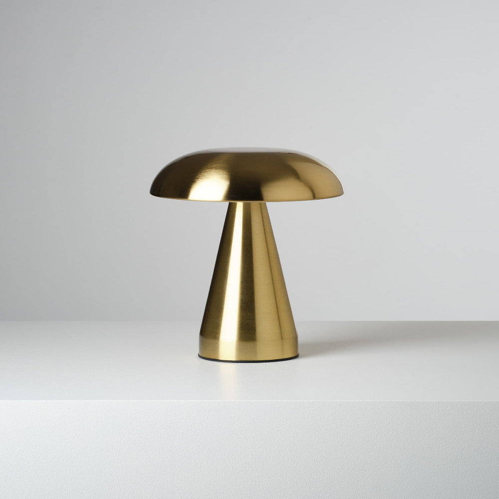 Gold table lamp on a white background