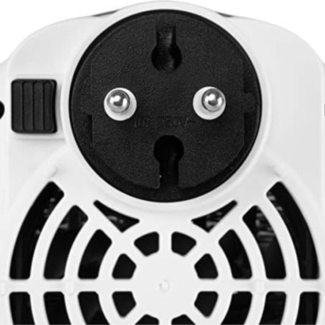 Close-up of a black and white electrical plug on a white background