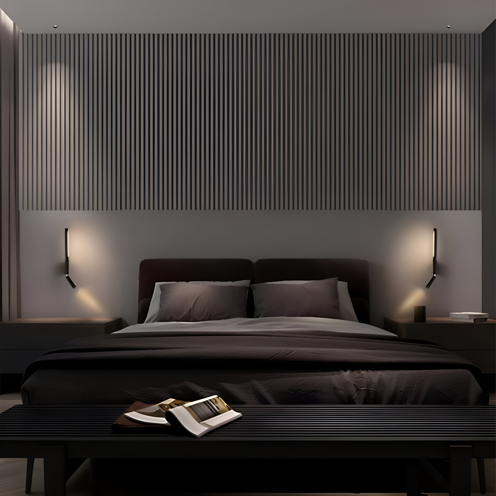 Modern bedroom with dark bedding and wall lights