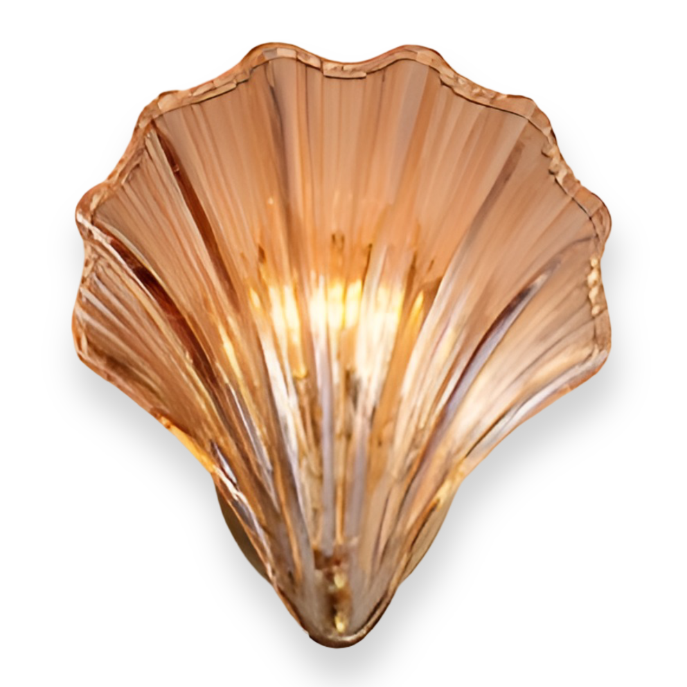 Shell-shaped wall light fixture on a white background