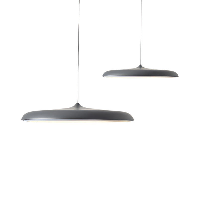 Two gray pendant lights hanging against a white background