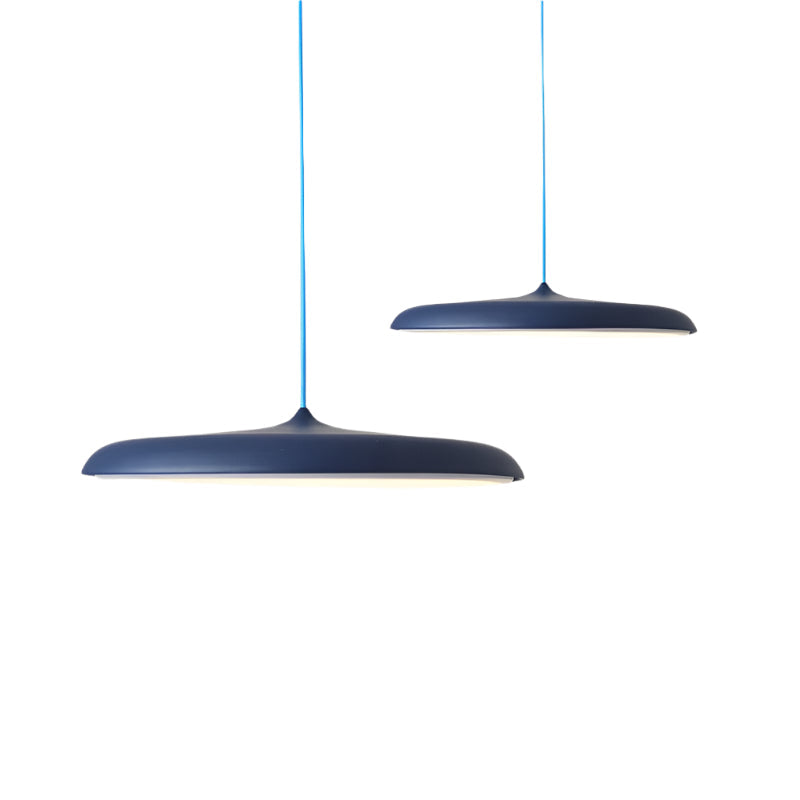 Two dark blue pendant lights with blue cords on a white background