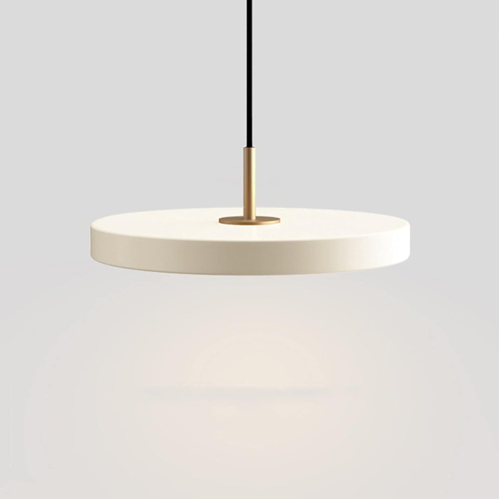 Pendant light with white concrete shade and gold fixture on a gray background