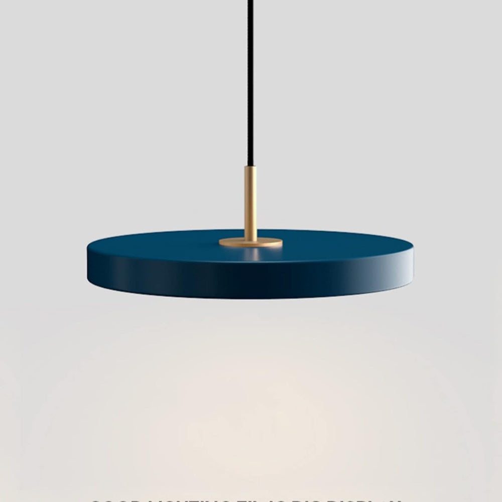 Blue pendant light with gold fixture on a gray background