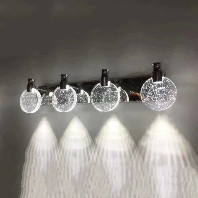 Modern ceiling light fixture with crystal-like glass shades on a dark background