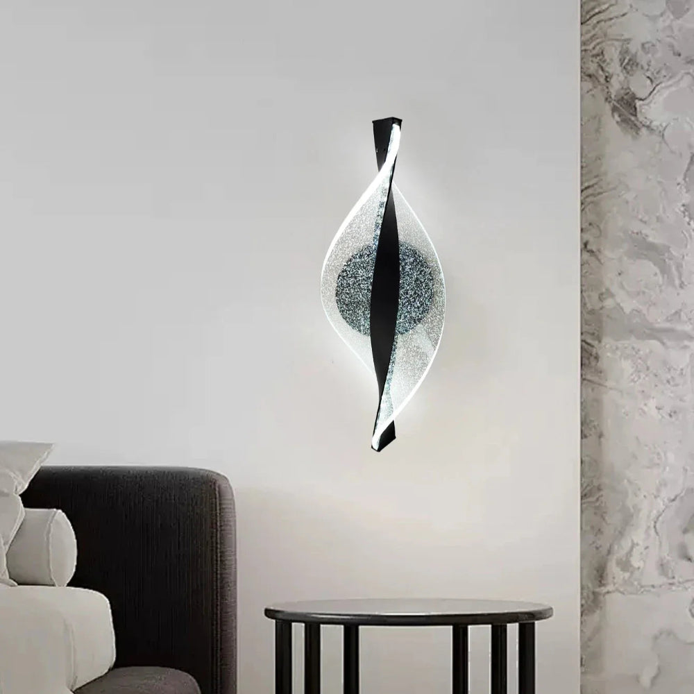 Modern wall light fixture in a room with a sofa and marble wall.