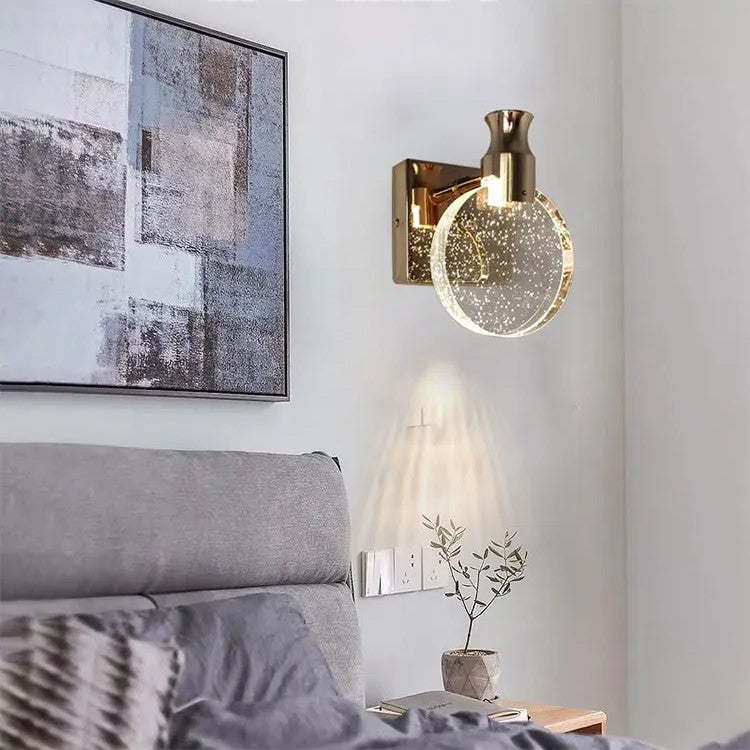 Modern wall sconce with decorative light fixture in a living room setting.