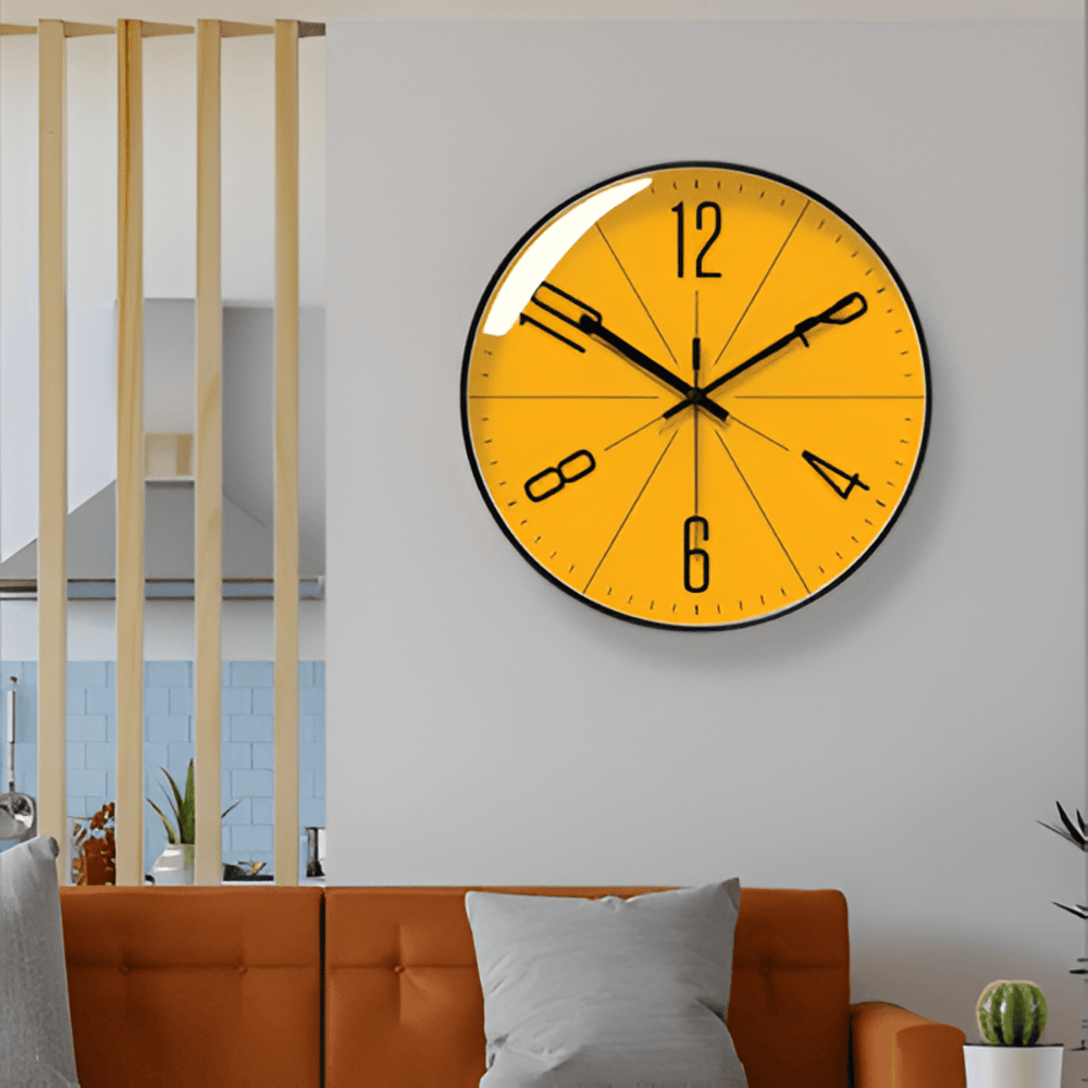 Yellow wall clock on a white wall with a modern interior setting.
