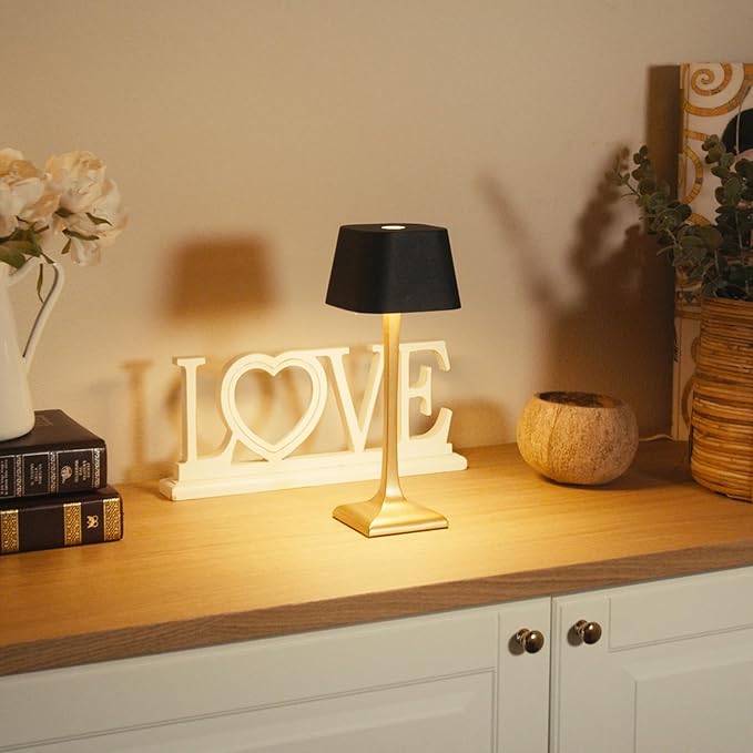 Decorative lamp with 'I LOVE' sign on a wooden surface