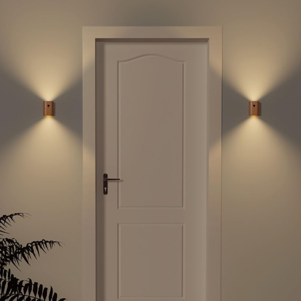 Door with wall lights on either side in a dimly lit room
