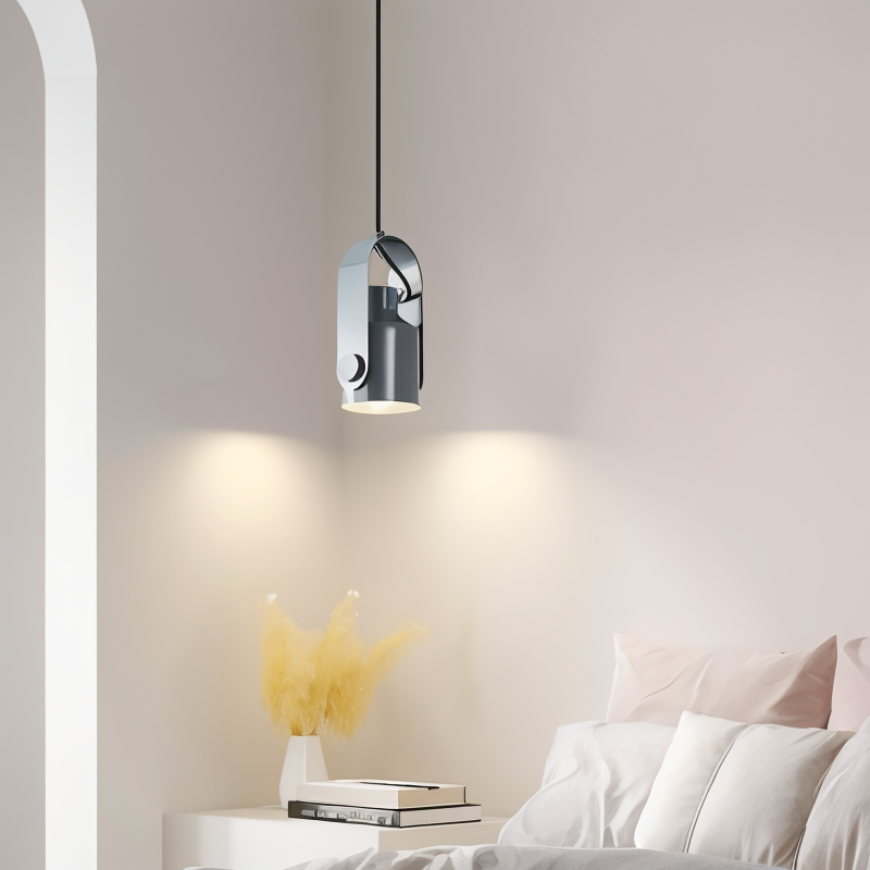 Modern pendant light fixture in a bedroom setting with a neutral color palette.