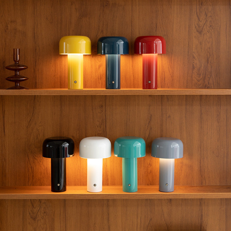 Colorful lampshades on wooden shelves