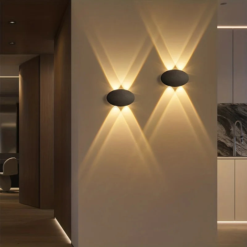 Modern wall lights on a wall with a kitchen background