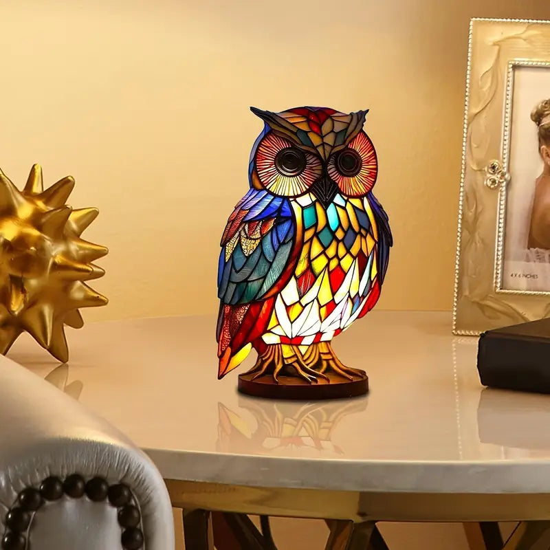 Colorful owl-shaped lamp on a table with decorative items in the background