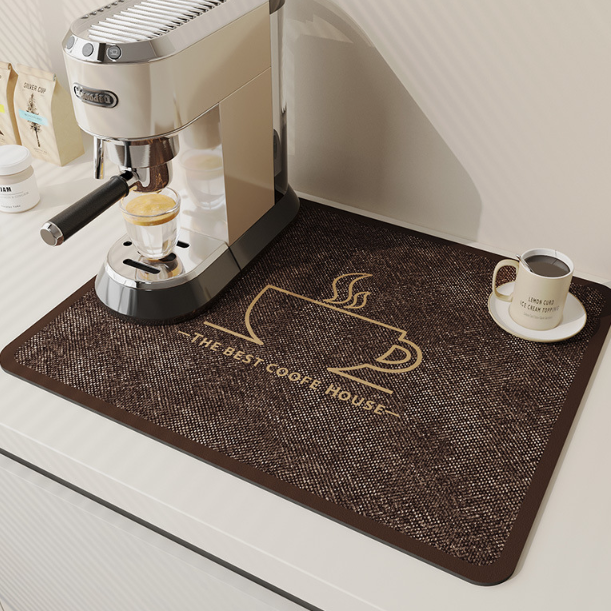Coffee machine on a mat with a coffee cup and saucer, featuring 'The Best Coffee House' text.