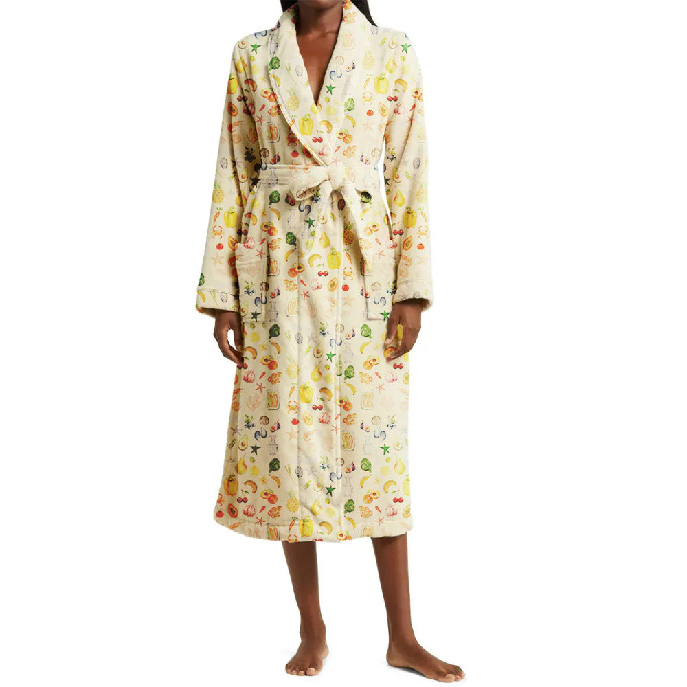 Person wearing a patterned robe on a white background
