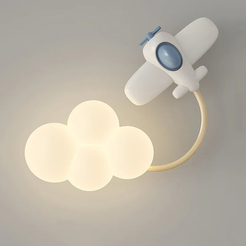 Children's wall lamp shaped like an airplane with cloud lights on a gray background