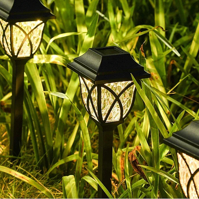 Solar garden lights in a grassy area