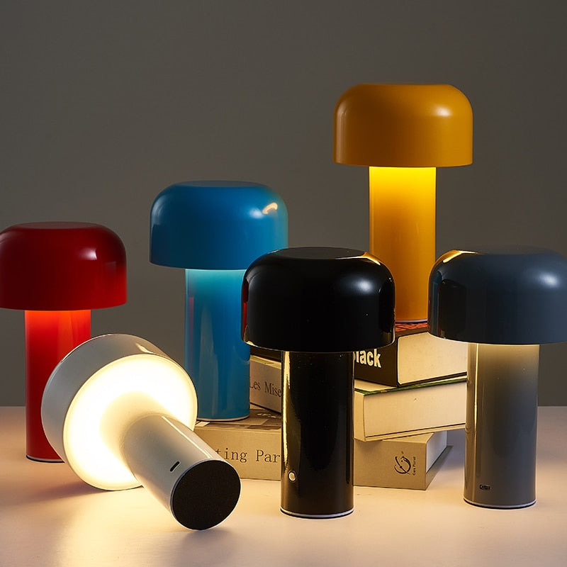 Collection of colorful table lamps on a dark background