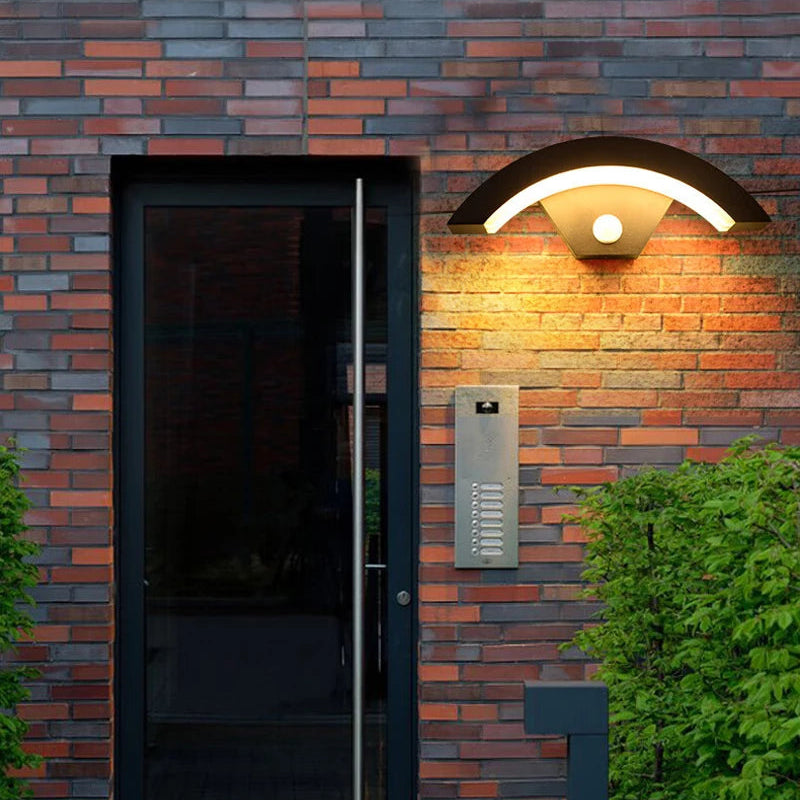 Outdoor wall light fixture on a brick wall with and without human radar sensing feature.