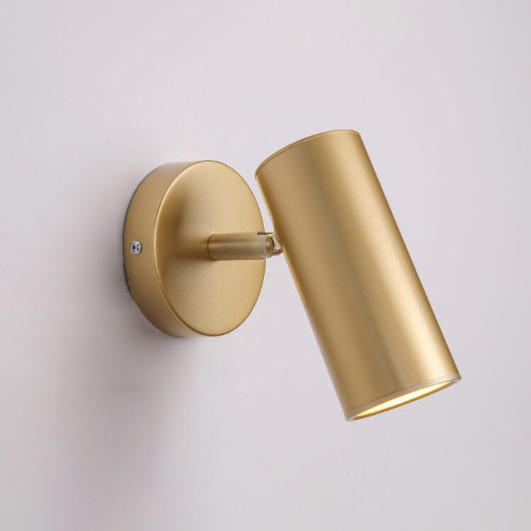 Gold wall-mounted light fixture on a plain background