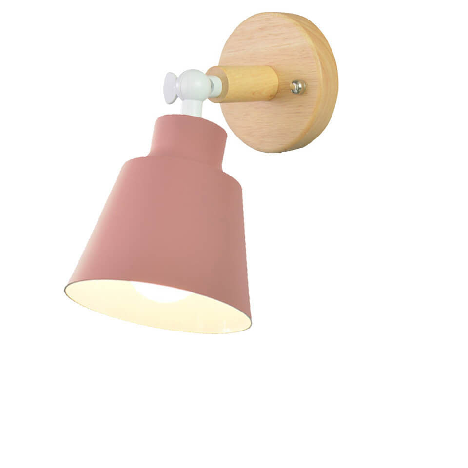 Wall lamp with pink shade and wooden fixture on a white background
