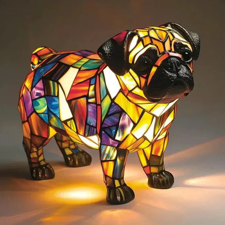 Colorful stained glass pug dog sculpture on a dark background